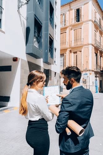 Real estate agents talking about documents